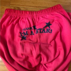 Red sweat Pants with 'I'm a Star' writing Pearl movie